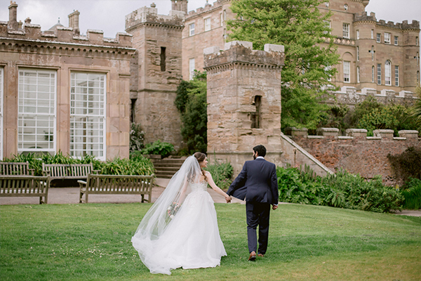 a bride and groom holding hands