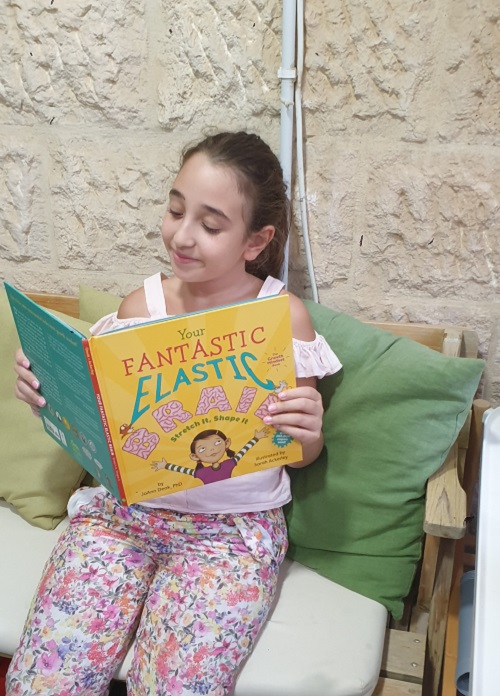 a little girl reading your fantastic elastic brain 