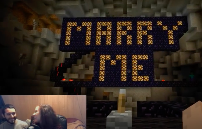 a guy proposing to a girl in a Minecraft theme