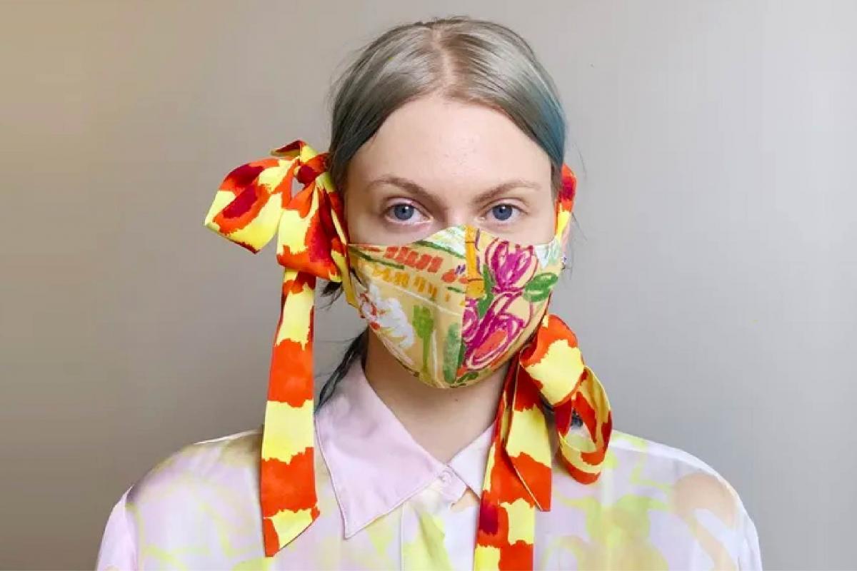 a women wearing a colorful face mask