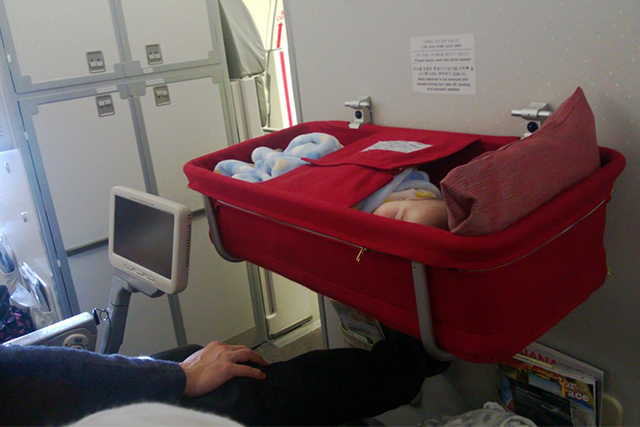 a mom with her little one in an airplane 