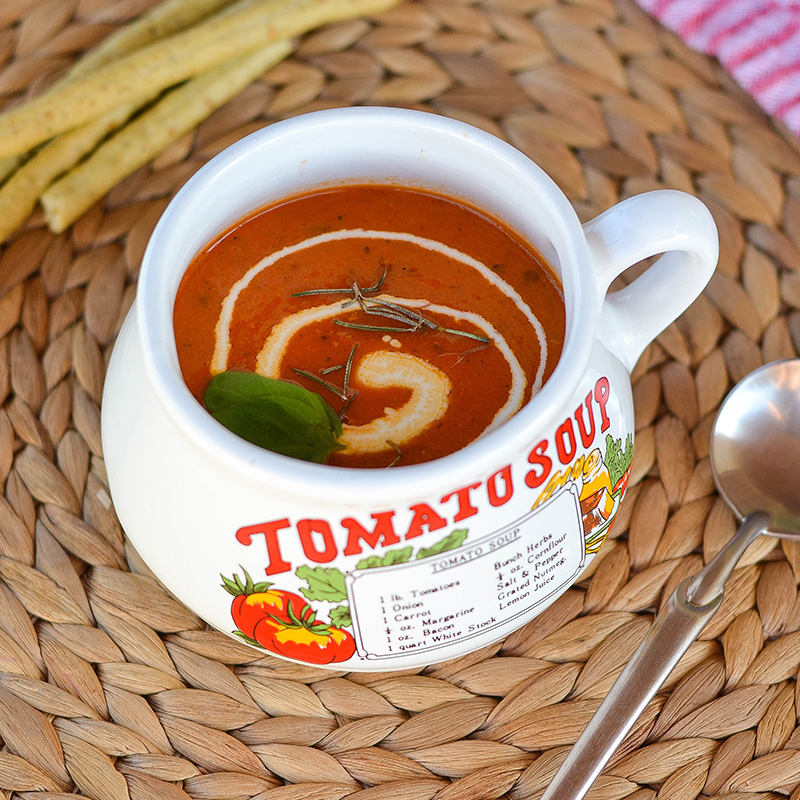  a Bowl filled with Tomato and Basil Soup