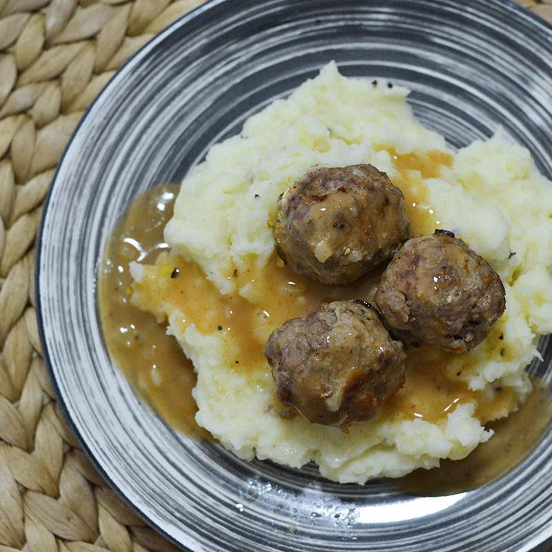  A Bowl filled with Swedish Meatballs with Gravy