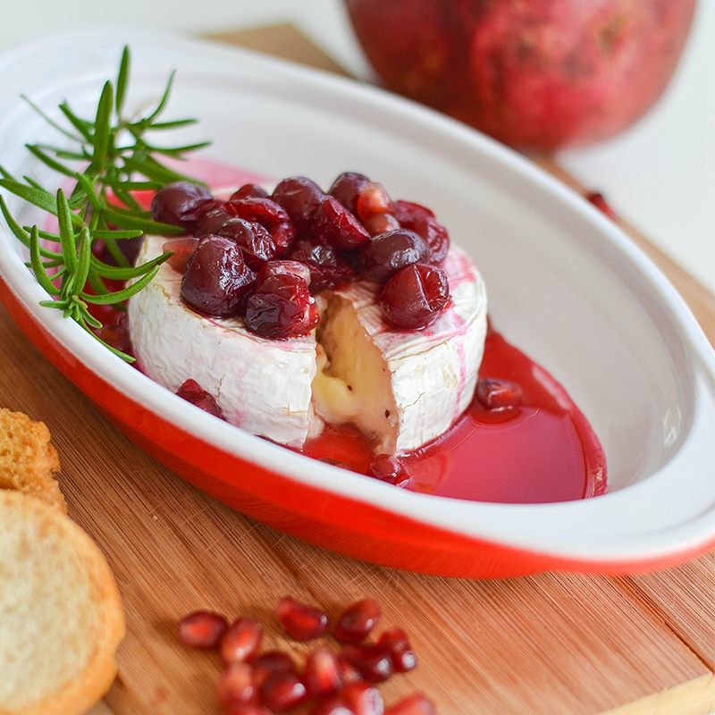 Pomegranate Cranberry Baked Brie in a plate