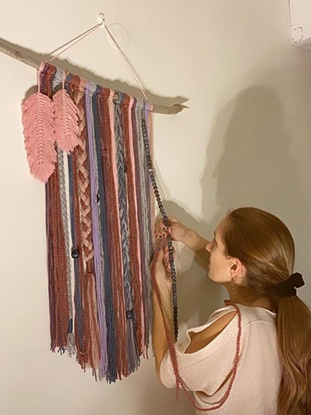 woman working on macrame